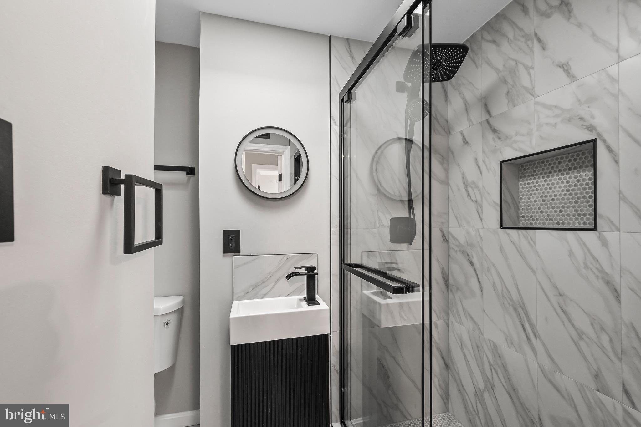 1527 North Colonial Terrace, Unit B Arlington, VA 22209 - Photo 26 of 28 a picture of a bathroom with a sink and a toilet