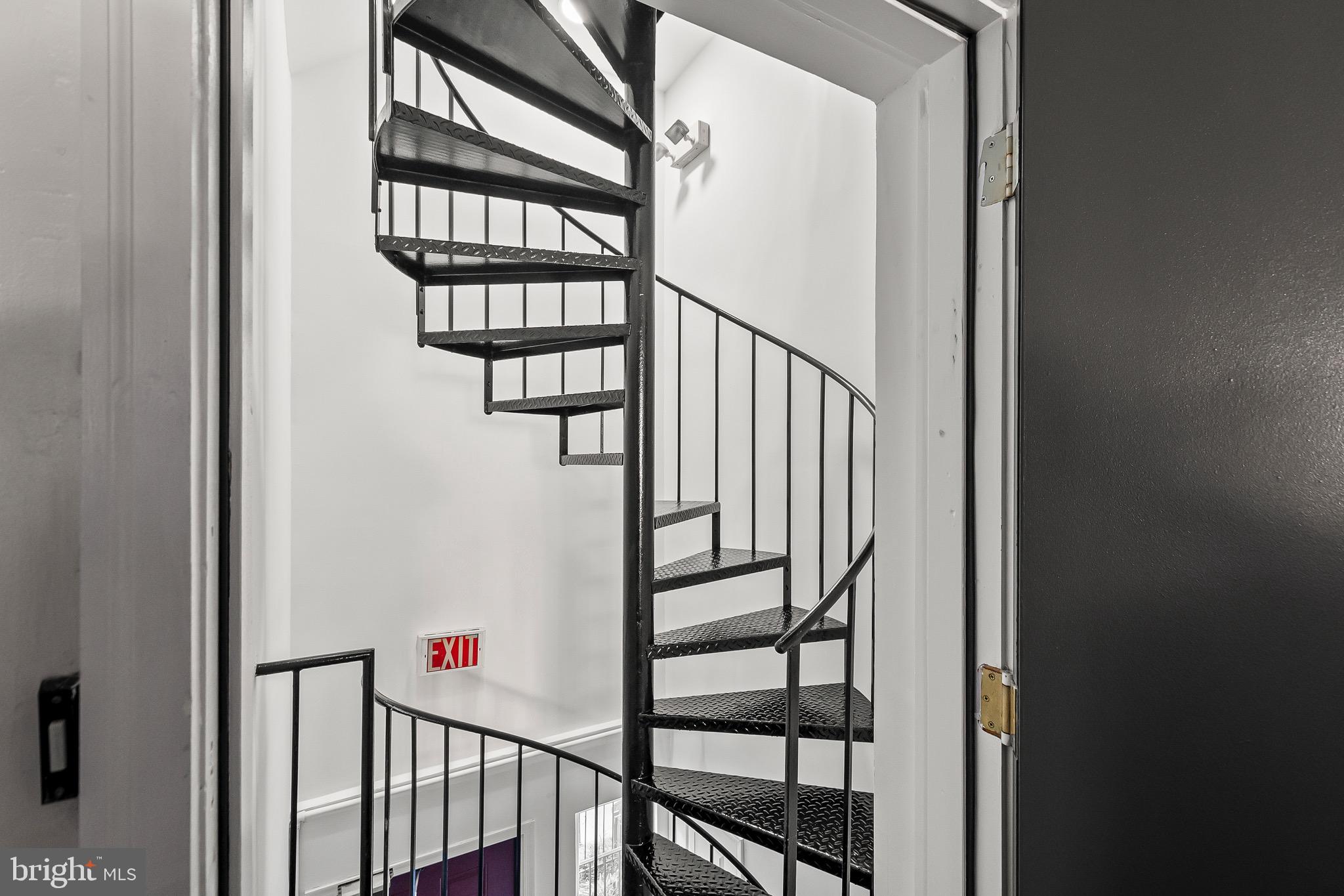 1527 North Colonial Terrace, Unit B Arlington, VA 22209 - Photo 4 of 28 a view of staircase with lots of frames on wall and a window