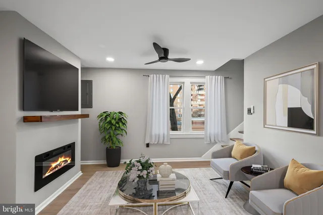 a view of kitchen with furniture and wooden floor