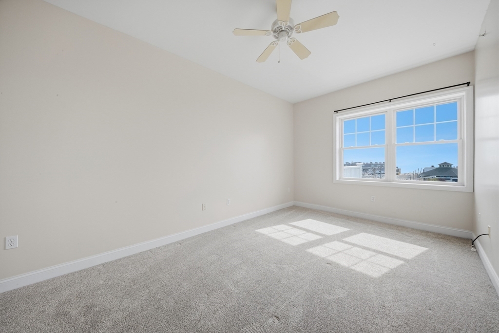 233 Beach Road, Unit A11 Salisbury, MA 01952 - Photo 19 of 37 an empty room with a window