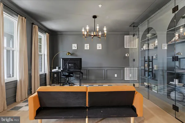 a living room with furniture and a window