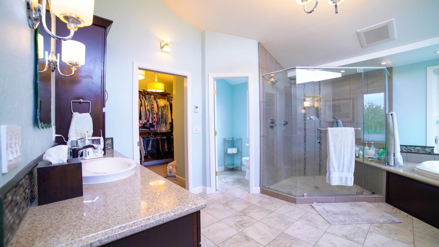 150 Amigo Road Soquel, CA 95073 - Photo 46 of 81 a spacious bathroom with a granite countertop sink a mirror a bathtub and shower