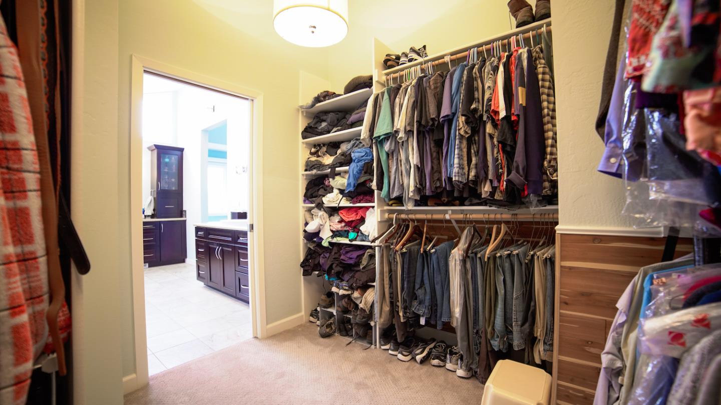 150 Amigo Road Soquel, CA 95073 - Photo 49 of 81 a view of walk in closet with clothes and shoes