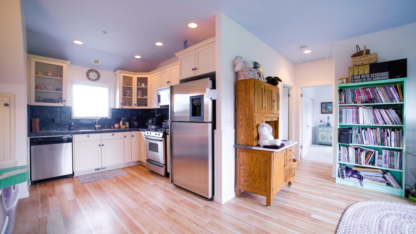 150 Amigo Road Soquel, CA 95073 - Photo 65 of 81 a kitchen with stainless steel appliances granite countertop a refrigerator and a wooden floor