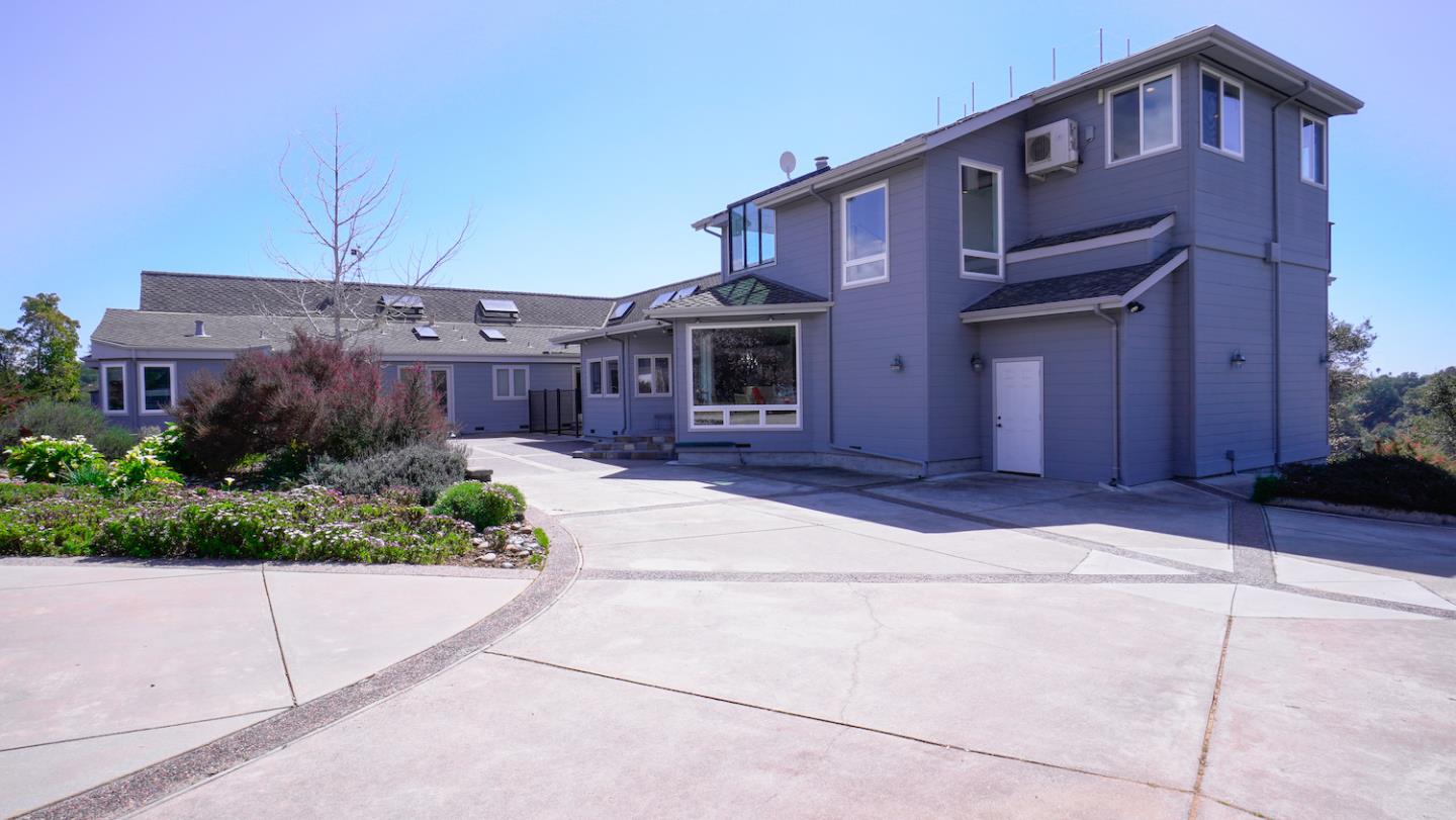 150 Amigo Road Soquel, CA 95073 - Photo 70 of 81 a front view of a house with a yard and potted plants