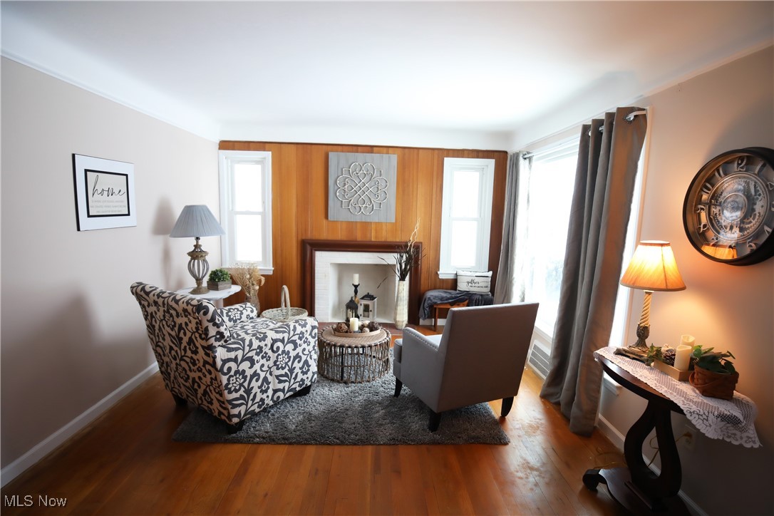 1344 Lander Road Cleveland, OH 44124 - Photo 25 of 49 Living area featuring plenty of natural light, wood finished floors, and wooden walls