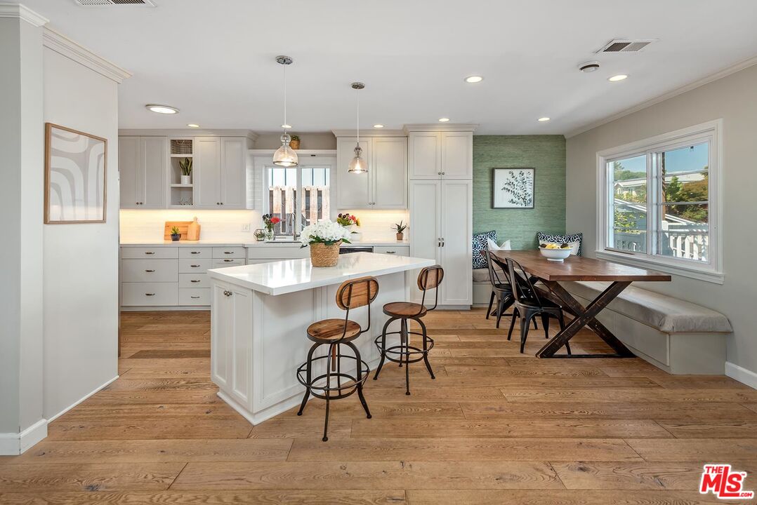 7517 Earldom Avenue Playa del Rey, CA 90293 - Photo 13 of 27 a view of a dining room with furniture window and wooden floor