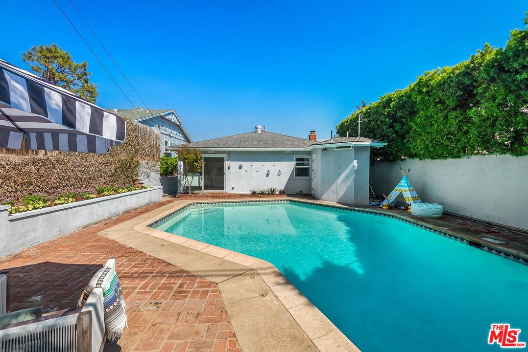 7517 Earldom Avenue Playa del Rey, CA 90293 - Photo 19 of 27 a front view of a house with a yard