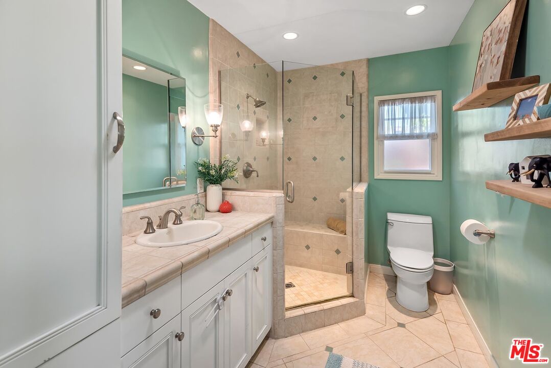 7517 Earldom Avenue Playa del Rey, CA 90293 - Photo 23 of 27 a bathroom with a toilet sink and mirror