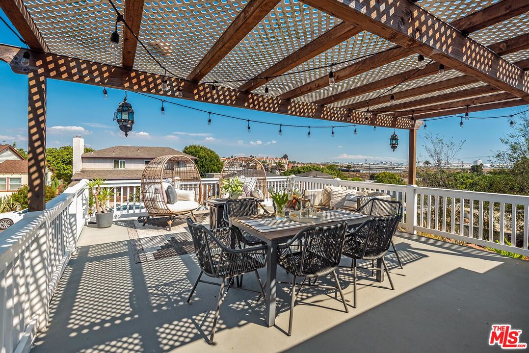 7517 Earldom Avenue Playa del Rey, CA 90293 - Photo 5 of 27 a view of a table and chairs in patio