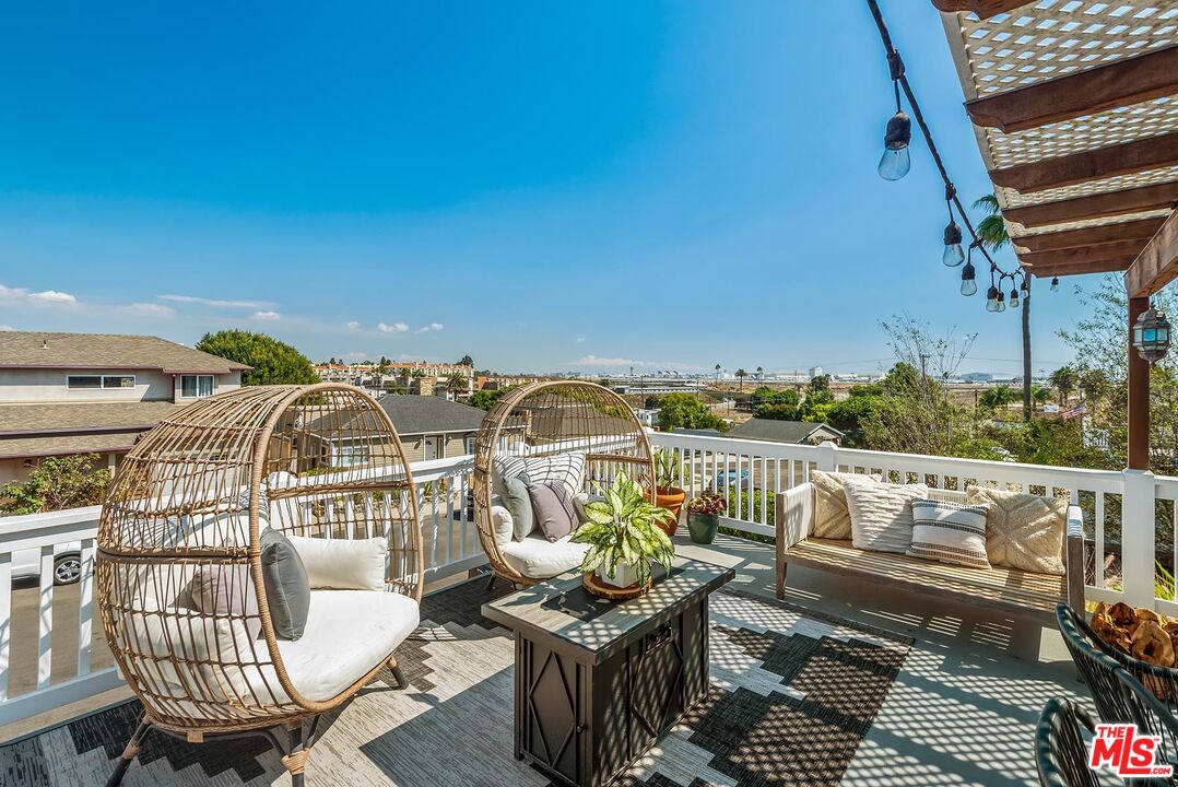 7517 Earldom Avenue Playa del Rey, CA 90293 - Photo 7 of 27 a view of a balcony with chairs