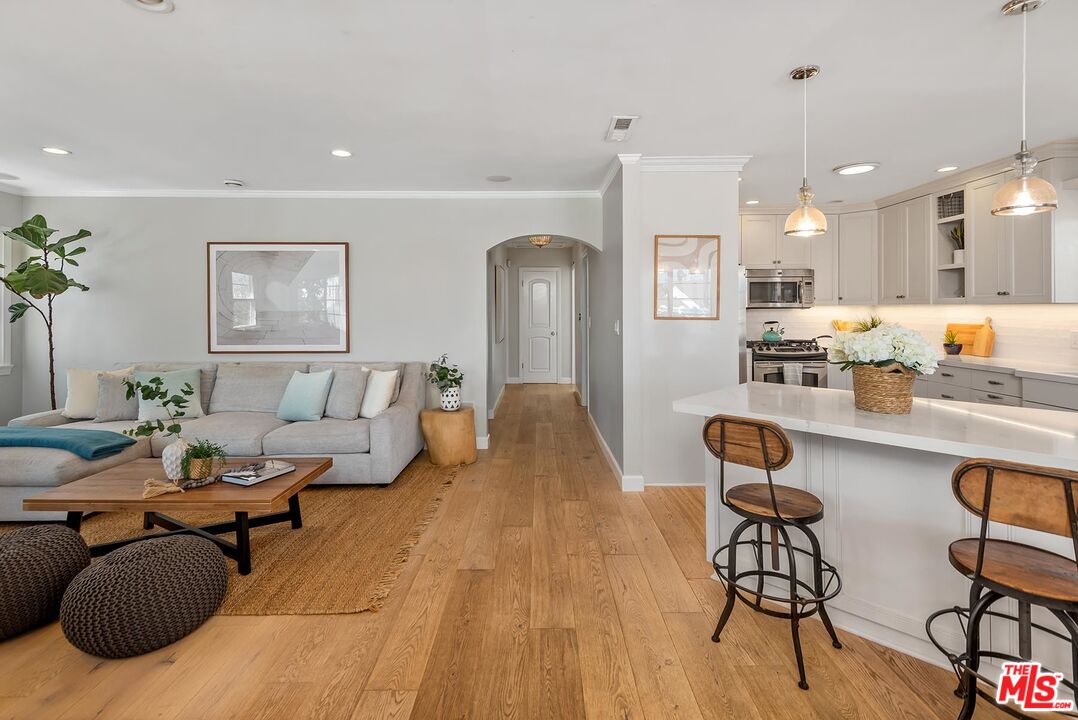 7517 Earldom Avenue Playa del Rey, CA 90293 - Photo 9 of 27 a living room with furniture and wooden floor