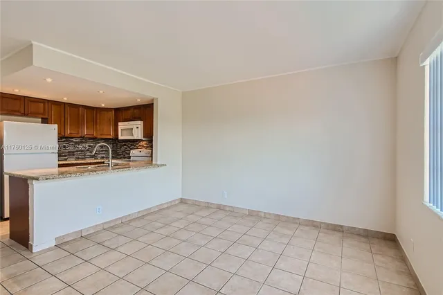 $229,000 | 1855 Plunkett Street, Unit 406, Hollywood, FL 33020