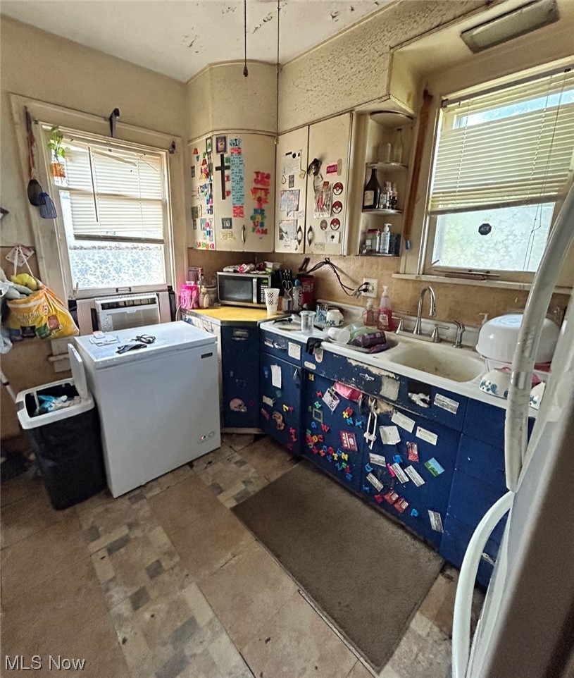 1450 Clearaire Road Cleveland, OH 44110 - Photo 21 of 27 Kitchen with dark tile flooring