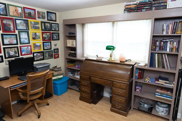 a bedroom with furniture and window