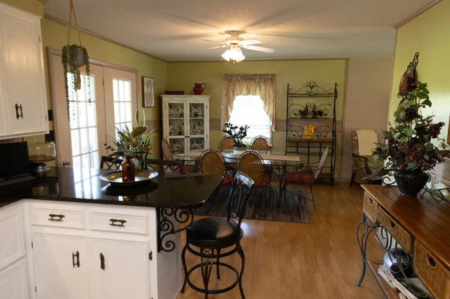 a view of a dining room with furniture and window