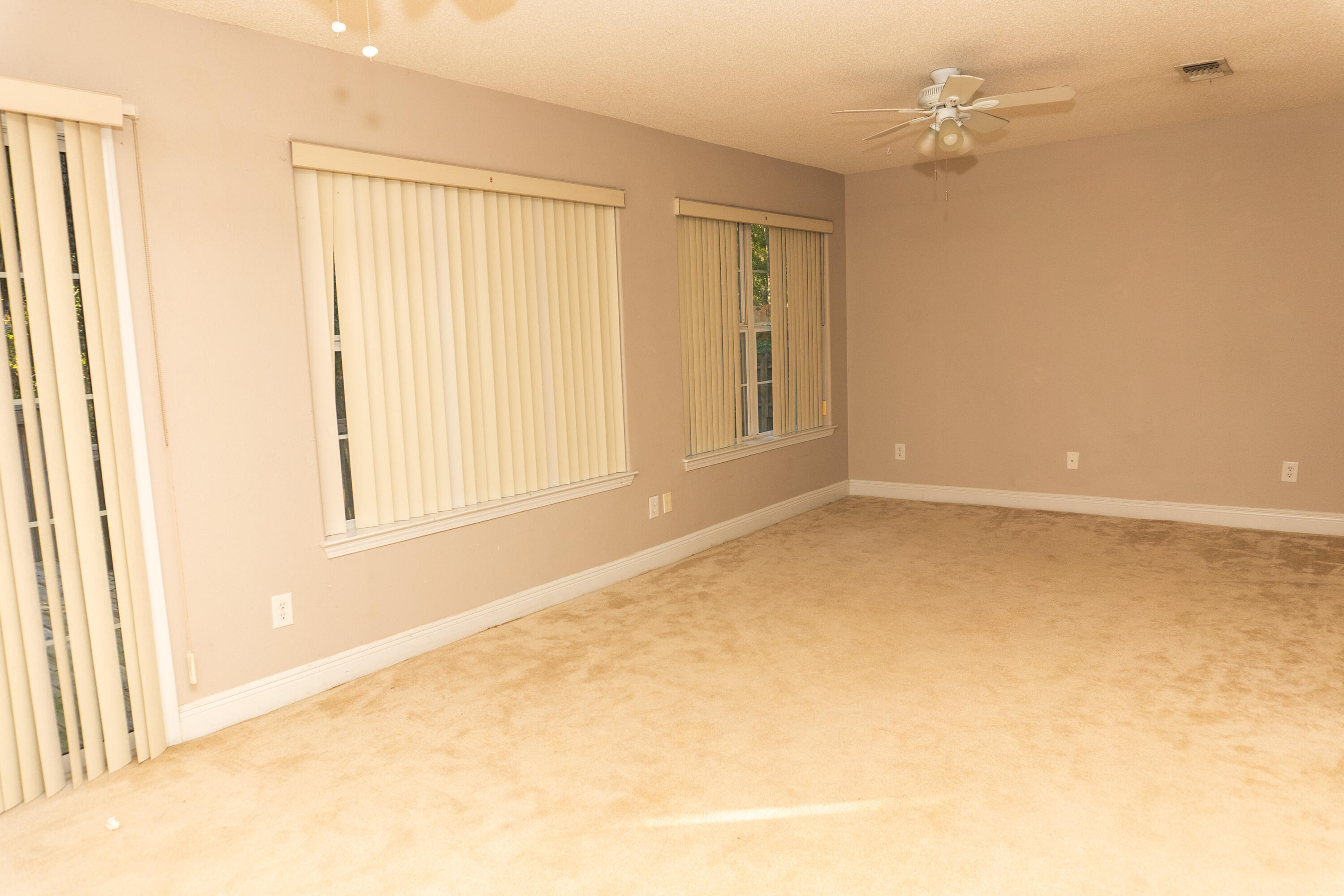 516 Vulpes Sanctuary Loop Crestview, FL 32536 - Photo 13 of 33 a view of an empty room with a window