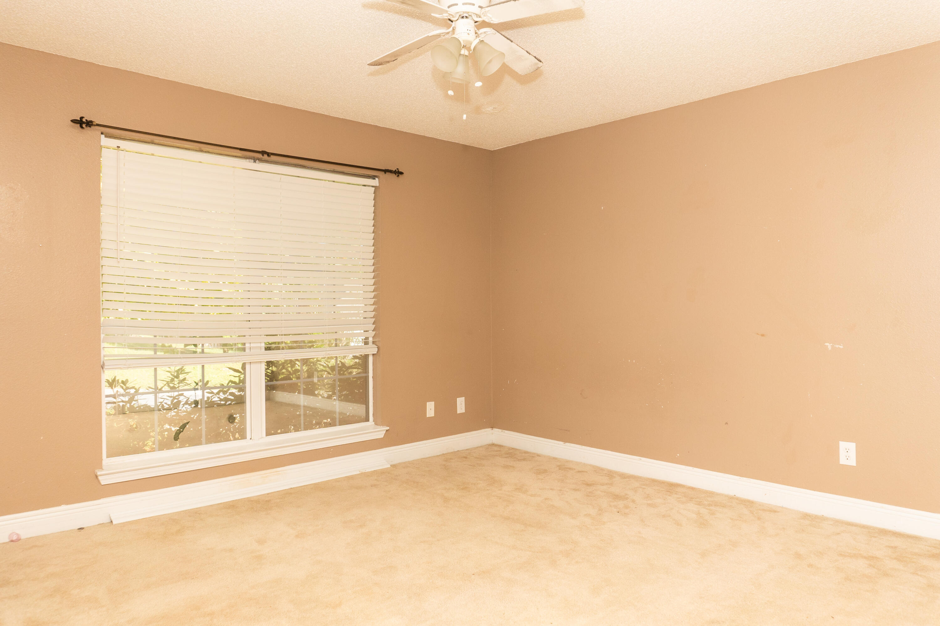 516 Vulpes Sanctuary Loop Crestview, FL 32536 - Photo 19 of 33 a view of an empty room with a window