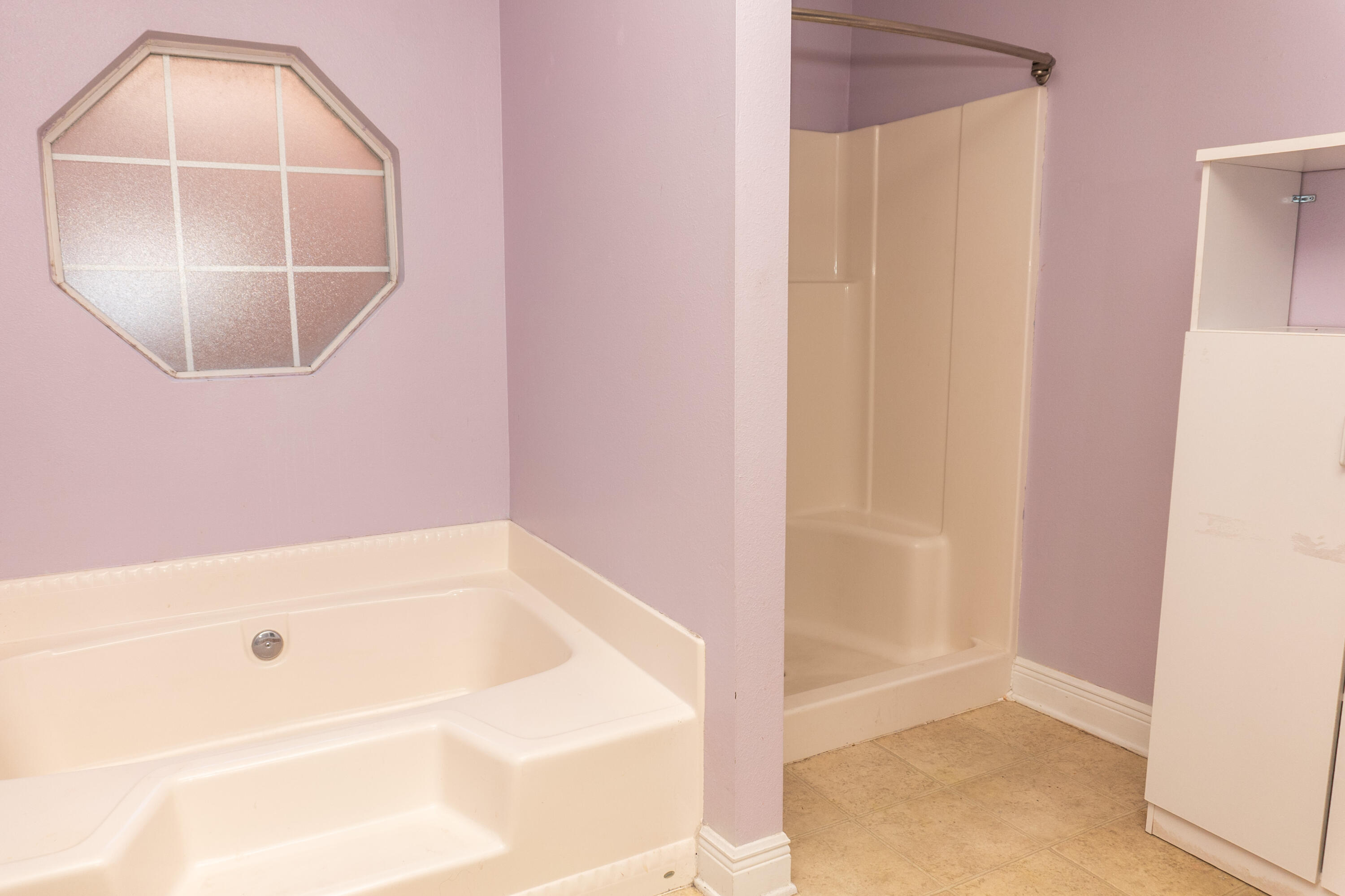 516 Vulpes Sanctuary Loop Crestview, FL 32536 - Photo 22 of 33 a bathroom with a tub and mirror