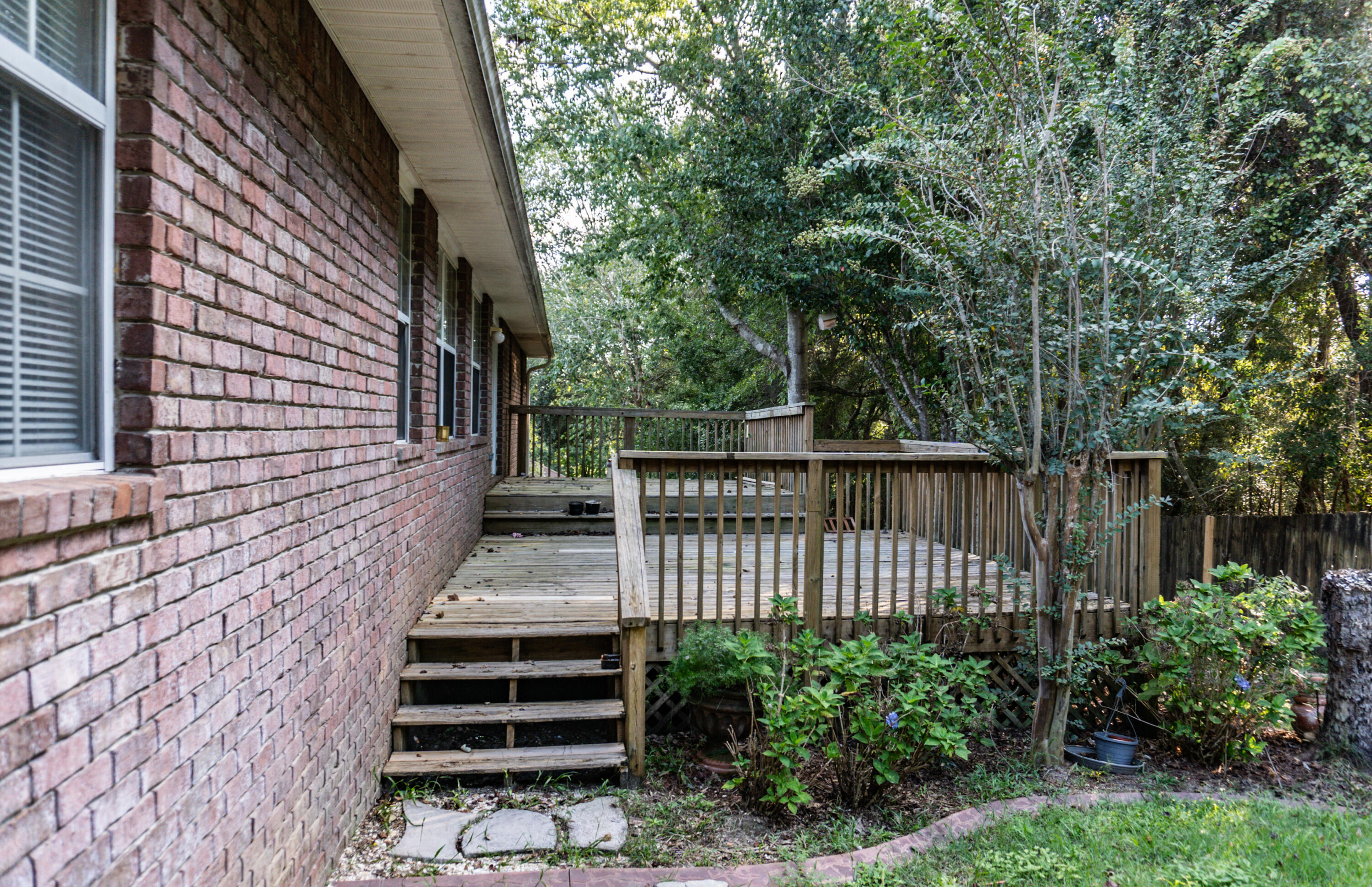 516 Vulpes Sanctuary Loop Crestview, FL 32536 - Photo 30 of 33 a view of a pathway of a building