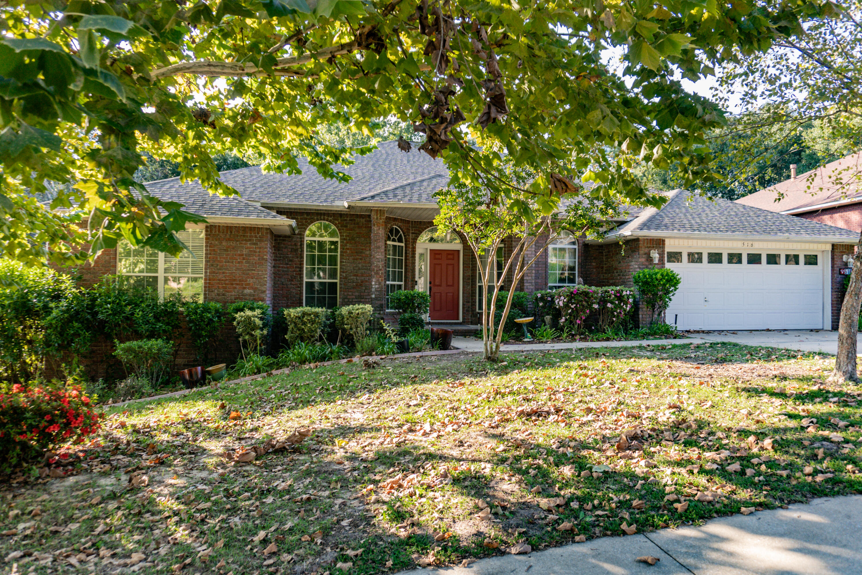 516 Vulpes Sanctuary Loop Crestview, FL 32536 - Photo 3 of 33 a front view of a house with a yard