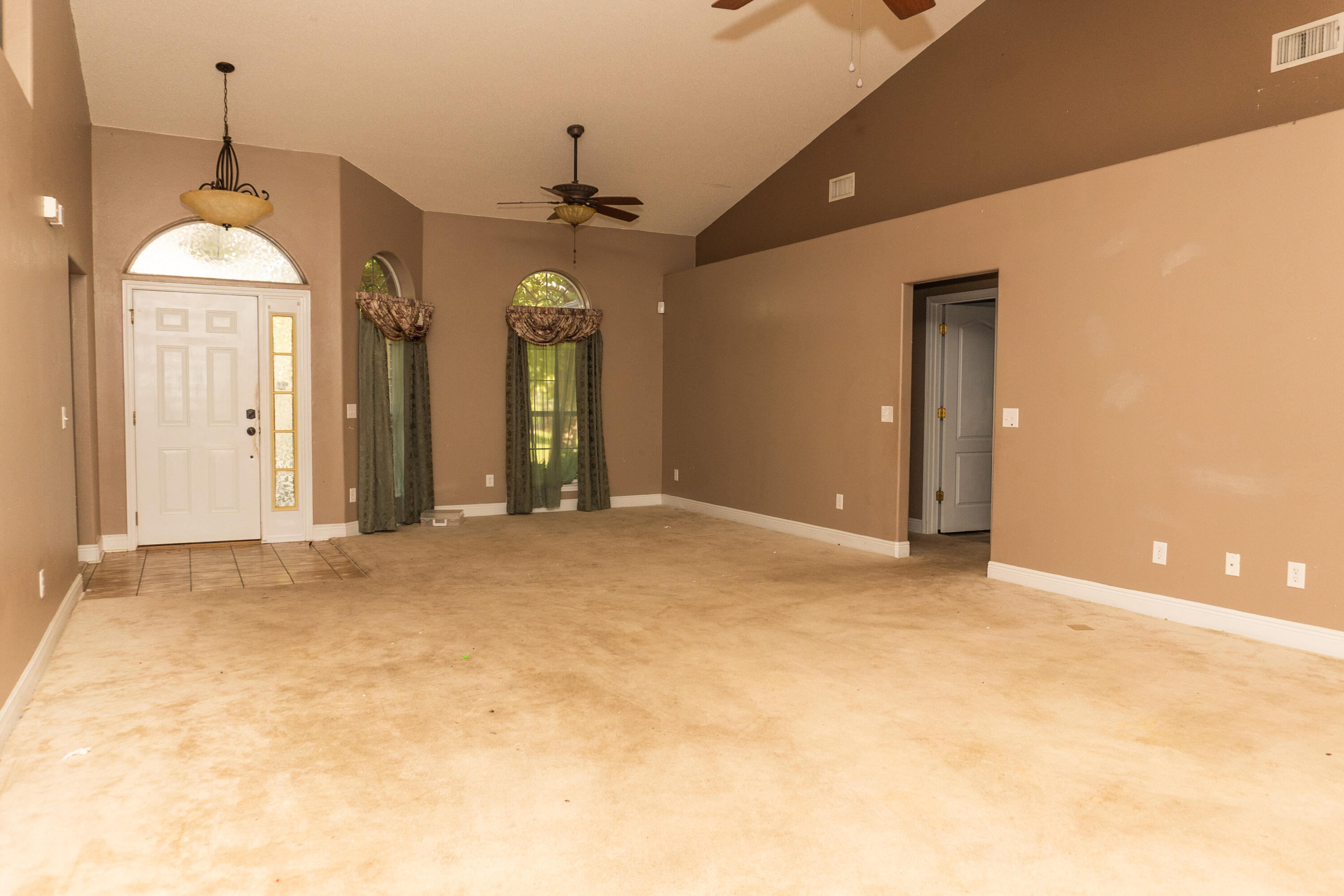 516 Vulpes Sanctuary Loop Crestview, FL 32536 - Photo 8 of 33 a view of a livingroom with a chandelier