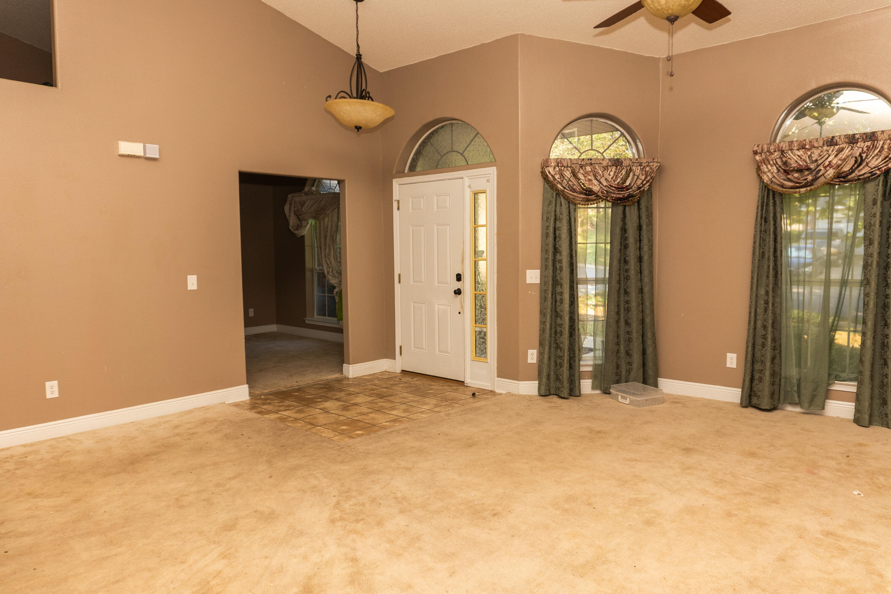 516 Vulpes Sanctuary Loop Crestview, FL 32536 - Photo 9 of 33 a view of a hallway with wooden floor