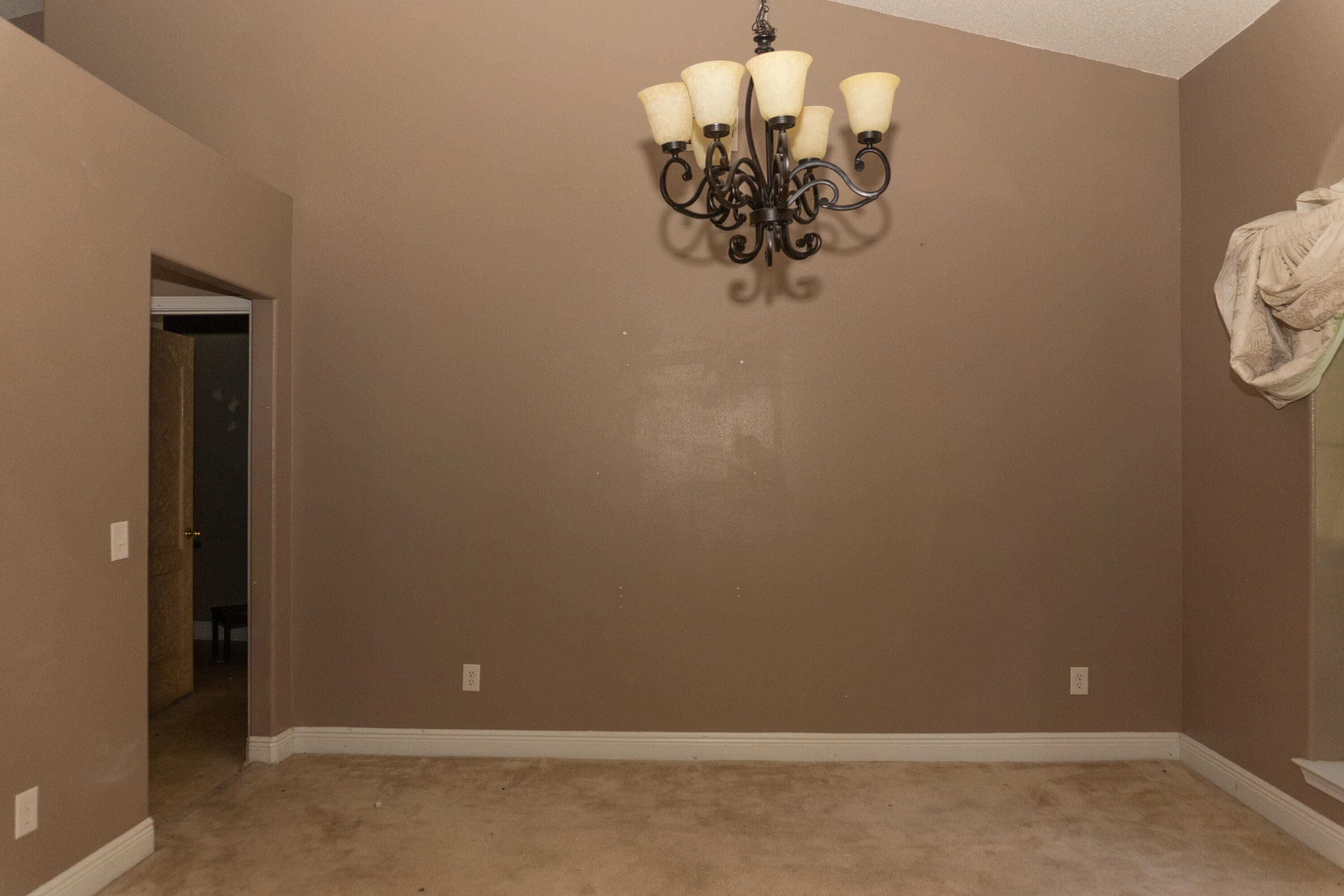 516 Vulpes Sanctuary Loop Crestview, FL 32536 - Photo 10 of 33 a view of a chandelier fan and wooden floor