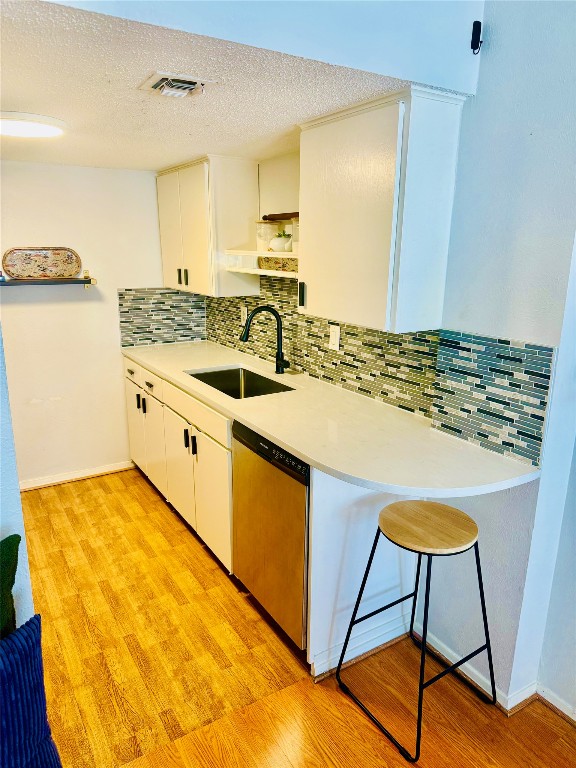 1800 Lavaca Street, Unit A305 Austin, TX 78701 - Photo 2 of 11 a kitchen with stainless steel appliances granite countertop a sink and a stove