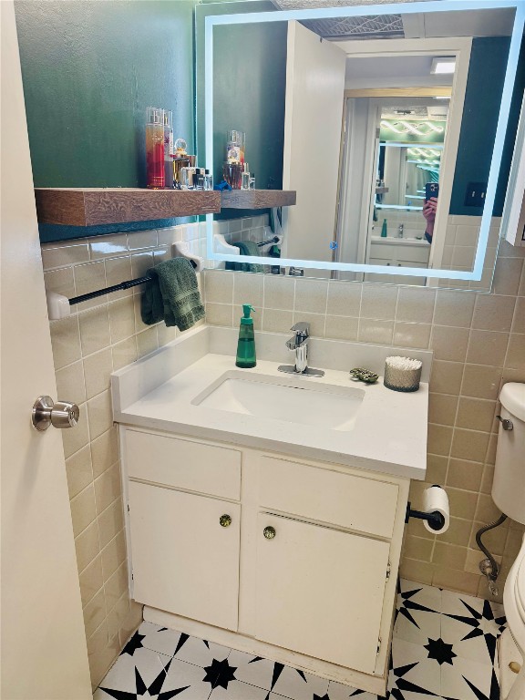 1800 Lavaca Street, Unit A305 Austin, TX 78701 - Photo 6 of 11 a bathroom with a sink and a mirror
