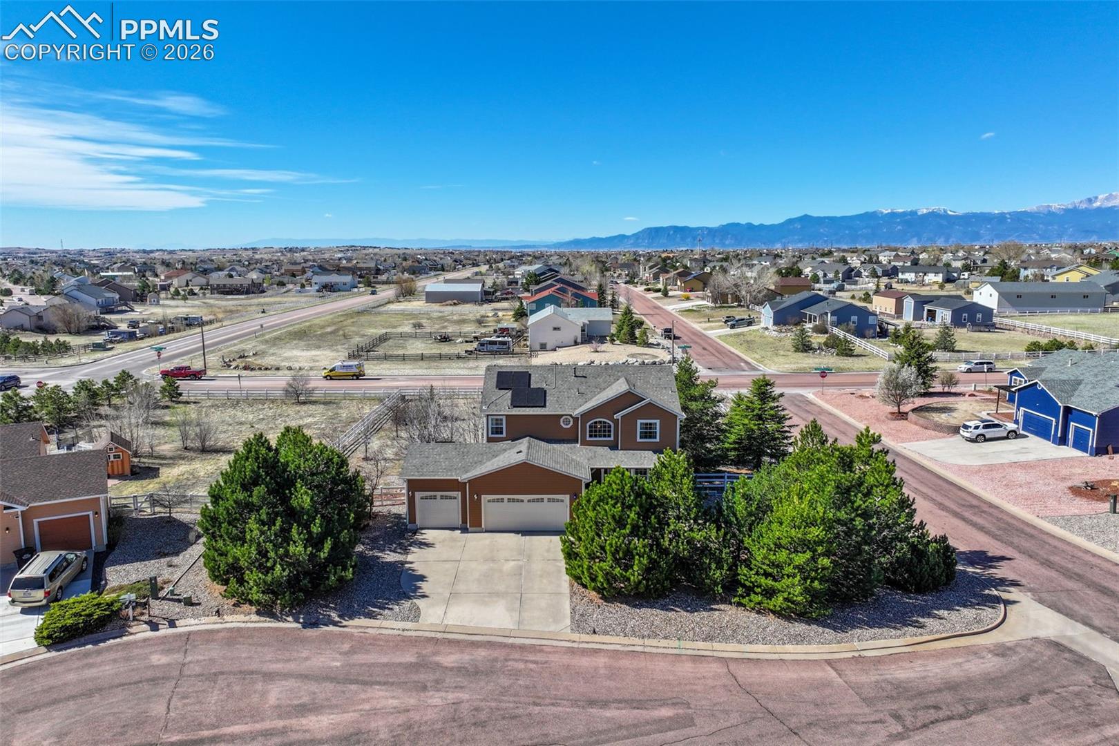 8407 Weiscamp Road Peyton, CO 80831 - Photo 2 of 49 Aerial view of residential area featuring a mountainous background