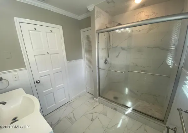 a bathroom with a shower and a toilet
