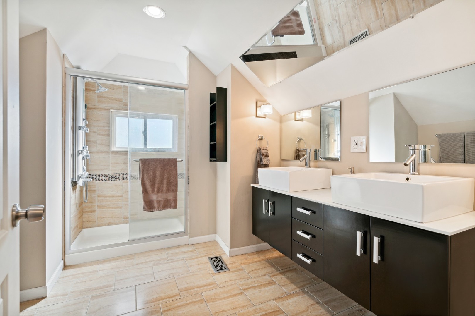 2239 North Keystone Avenue Chicago, IL 60639 - Photo 12 of 31 a spacious bathroom with a shower sink and mirror