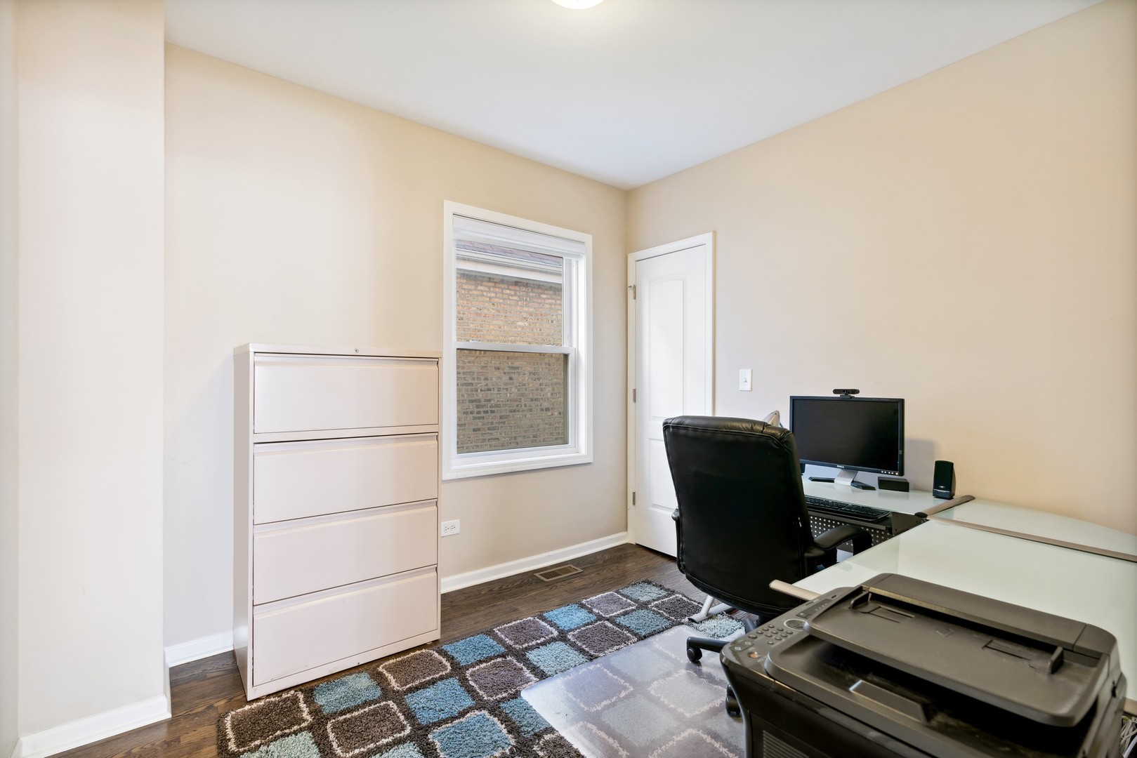 2239 North Keystone Avenue Chicago, IL 60639 - Photo 15 of 31 a view of a workspace with furniture and a window