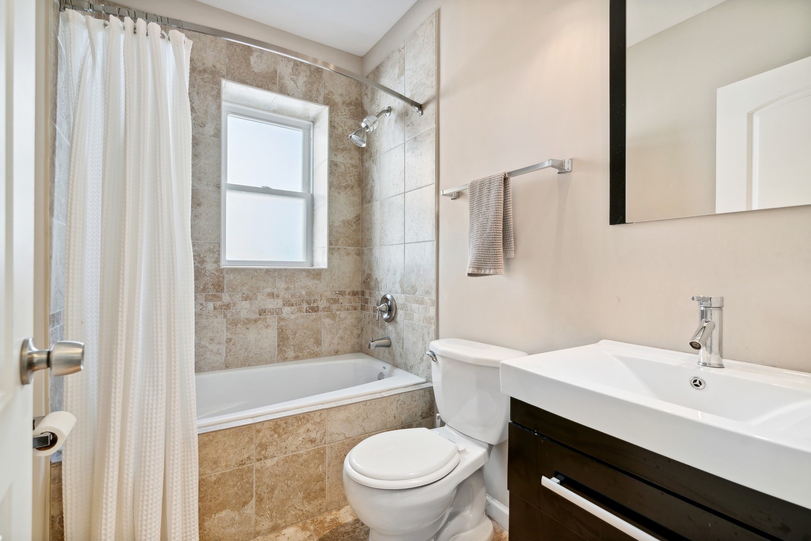 2239 North Keystone Avenue Chicago, IL 60639 - Photo 17 of 31 a bathroom with a sink a toilet and shower