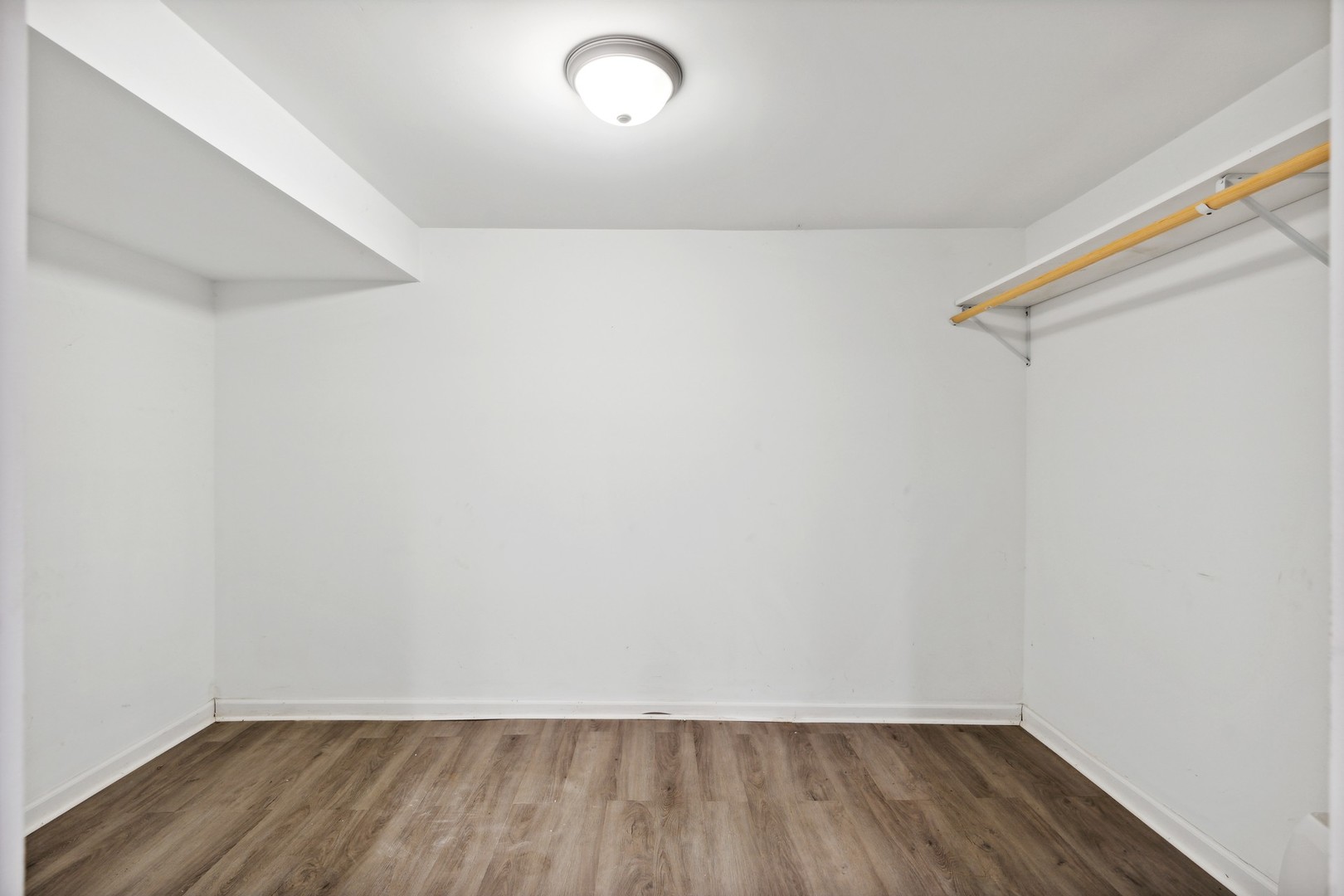 2239 North Keystone Avenue Chicago, IL 60639 - Photo 19 of 31 a view of room with wooden floor