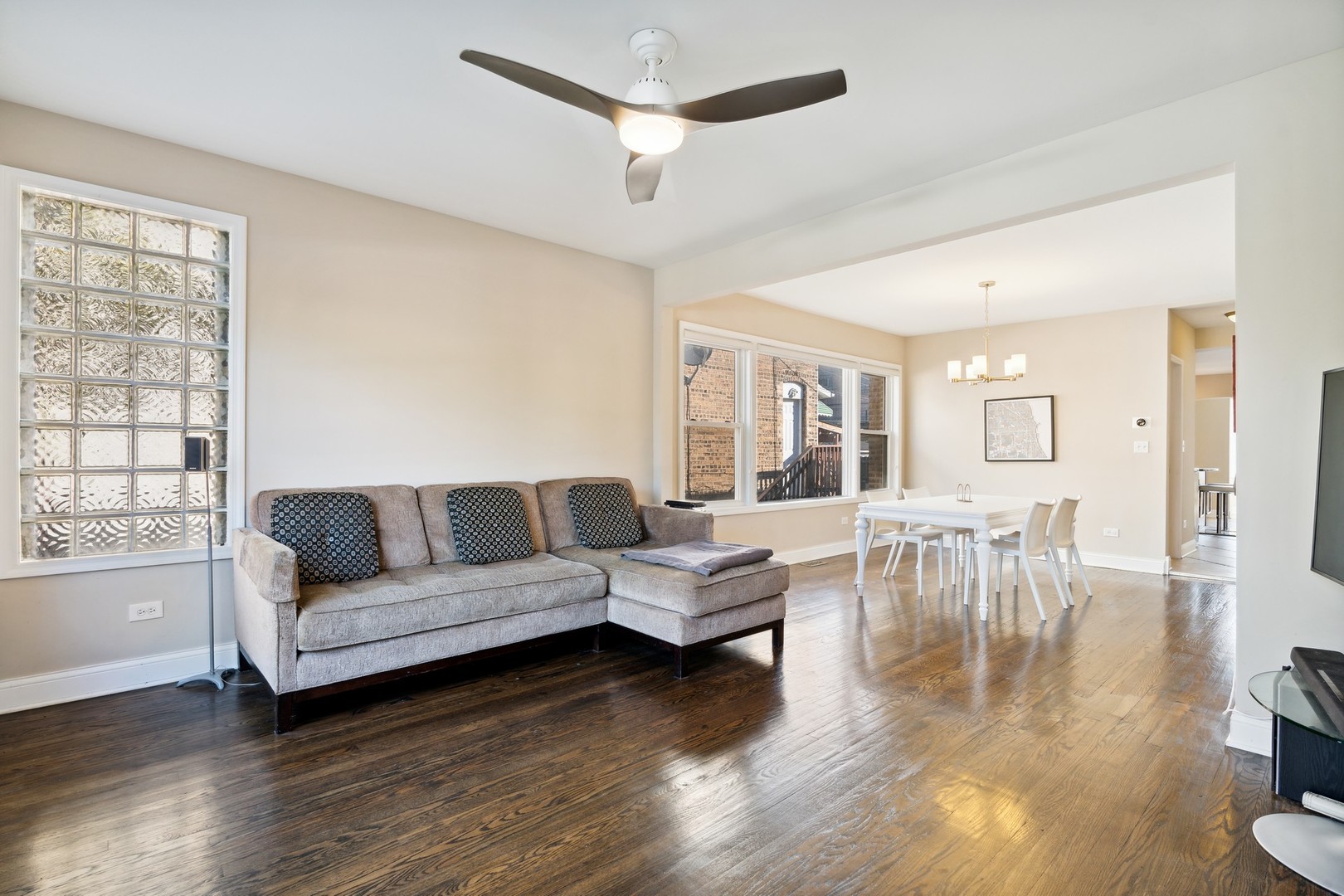 2239 North Keystone Avenue Chicago, IL 60639 - Photo 2 of 31 a living room with furniture and a large window