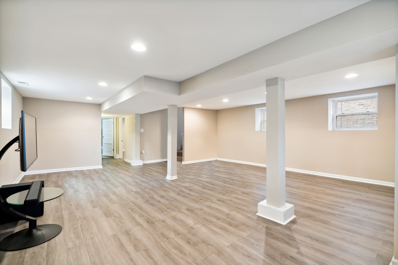 2239 North Keystone Avenue Chicago, IL 60639 - Photo 21 of 31 a view of an empty room with wooden floor and a window
