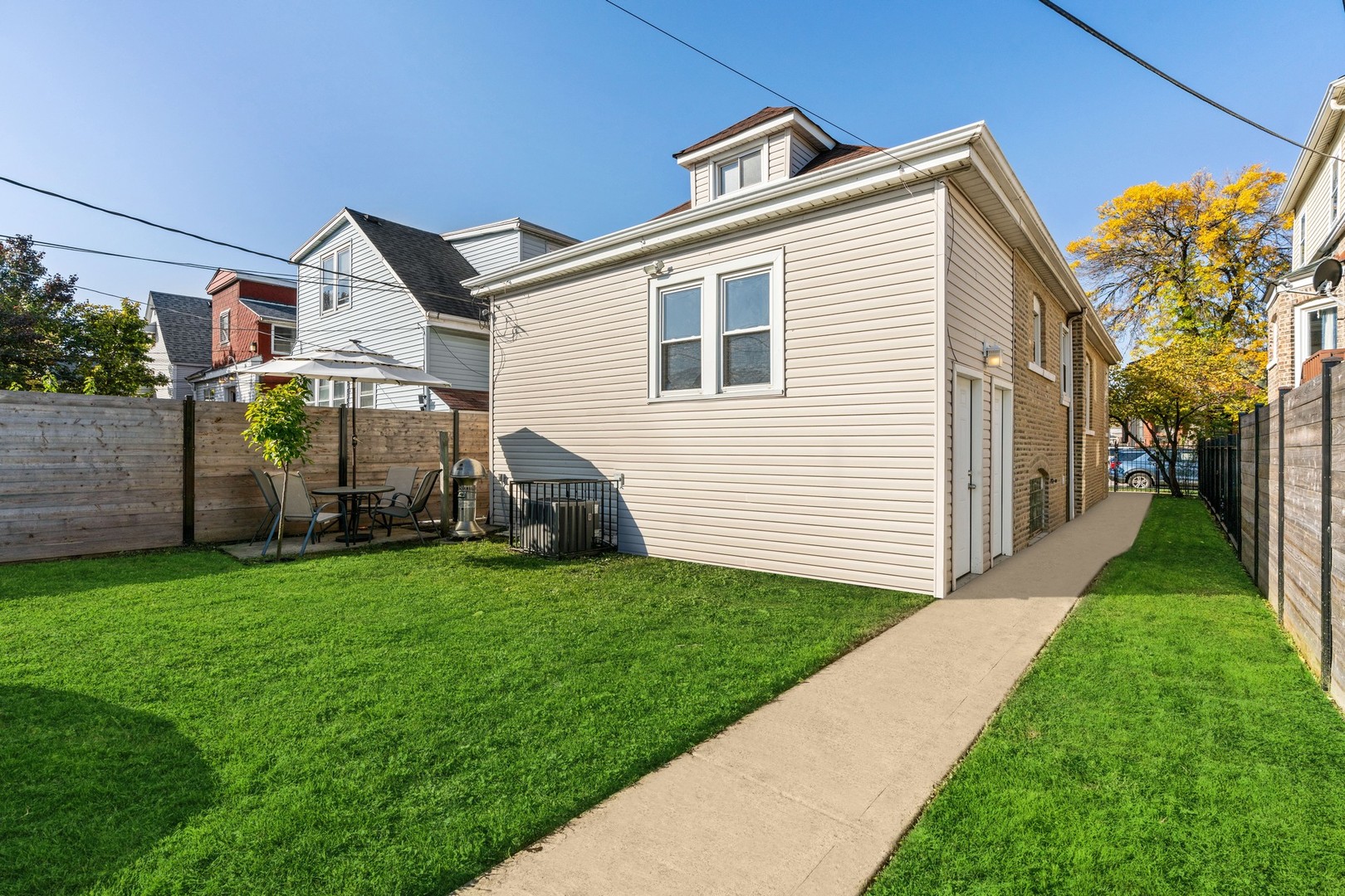 2239 North Keystone Avenue Chicago, IL 60639 - Photo 26 of 31 a view of a house with a yard