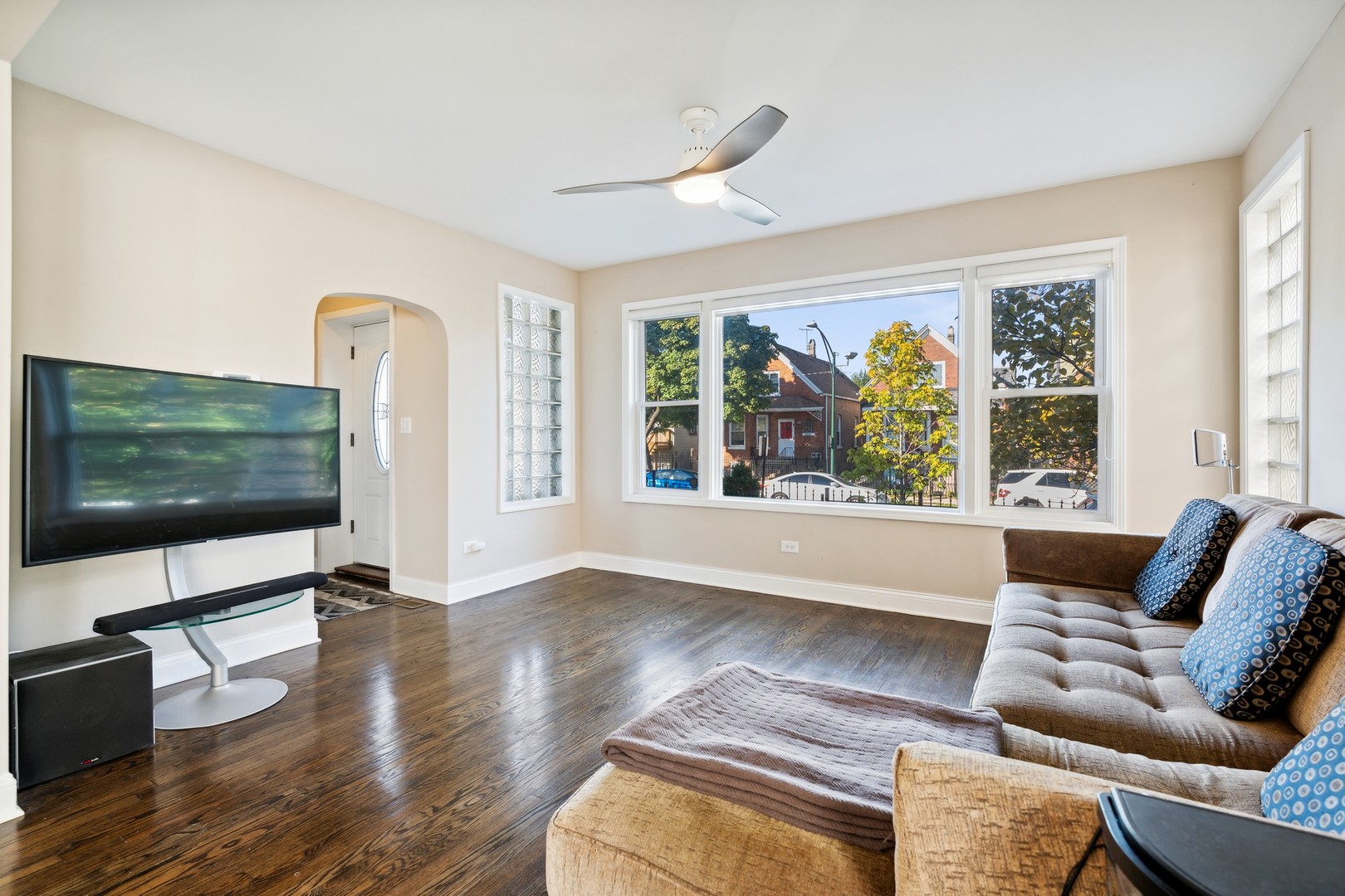 2239 North Keystone Avenue Chicago, IL 60639 - Photo 4 of 31 a living room with furniture and a flat screen tv