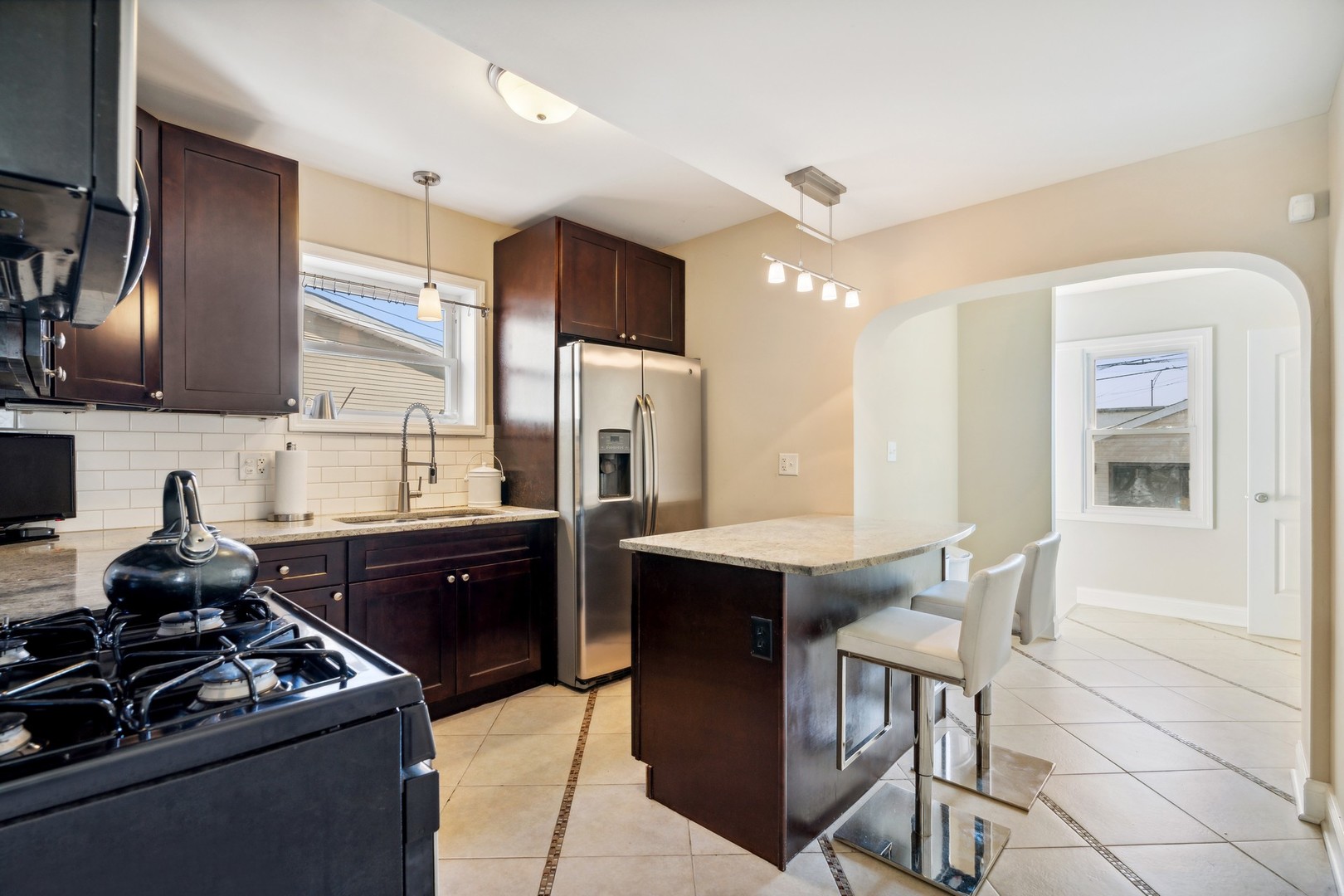 2239 North Keystone Avenue Chicago, IL 60639 - Photo 9 of 31 a kitchen with a sink stove and refrigerator