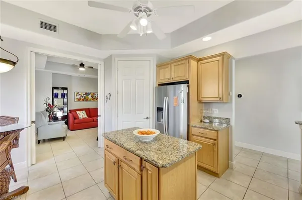 a kitchen with stainless steel appliances granite countertop a sink and cabinets