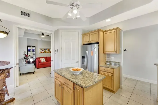 a kitchen with stainless steel appliances granite countertop a sink and cabinets