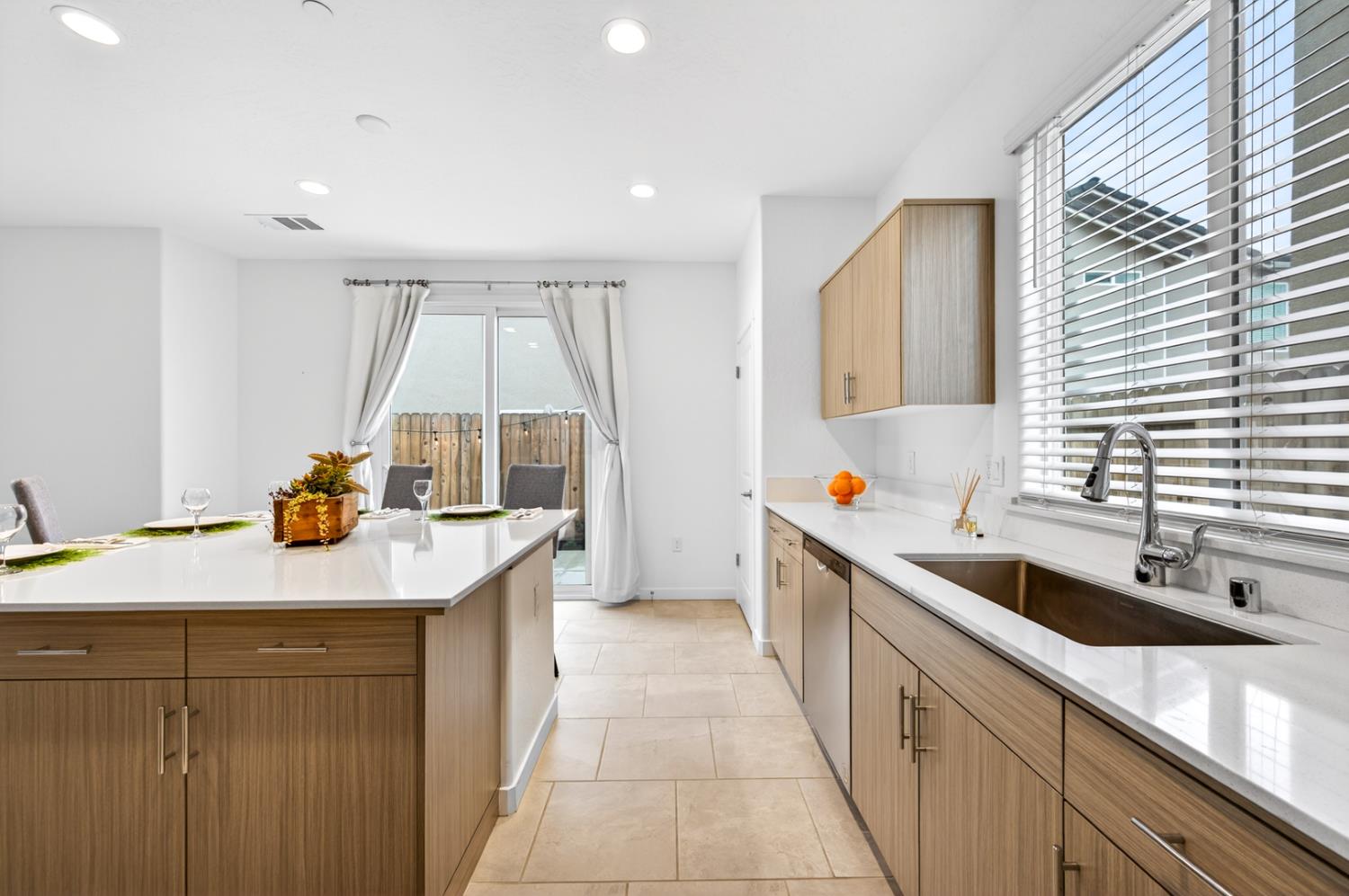 317 Talus Way South Madera, CA 93636 - Photo 10 of 61 a kitchen with a sink and a wooden floor