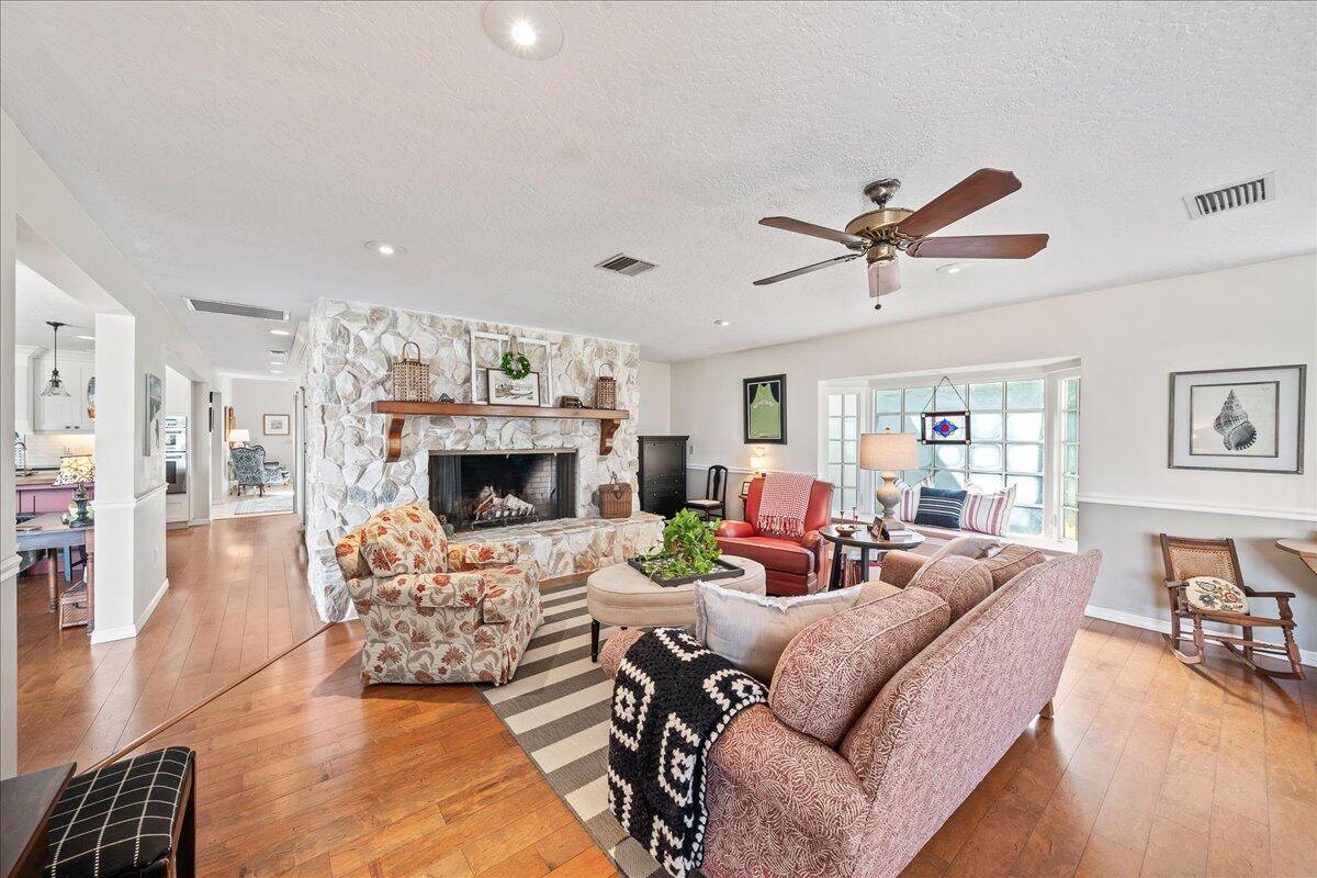 1650 North Riverside Drive Indialantic, FL 32903 - Photo 19 of 88 a living room with furniture a fireplace and wooden floor