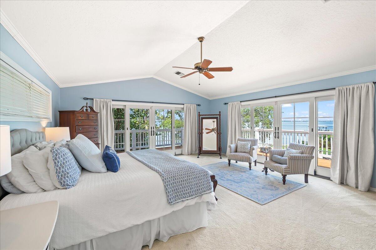 1650 North Riverside Drive Indialantic, FL 32903 - Photo 34 of 88 a bedroom with a large bed and a large window