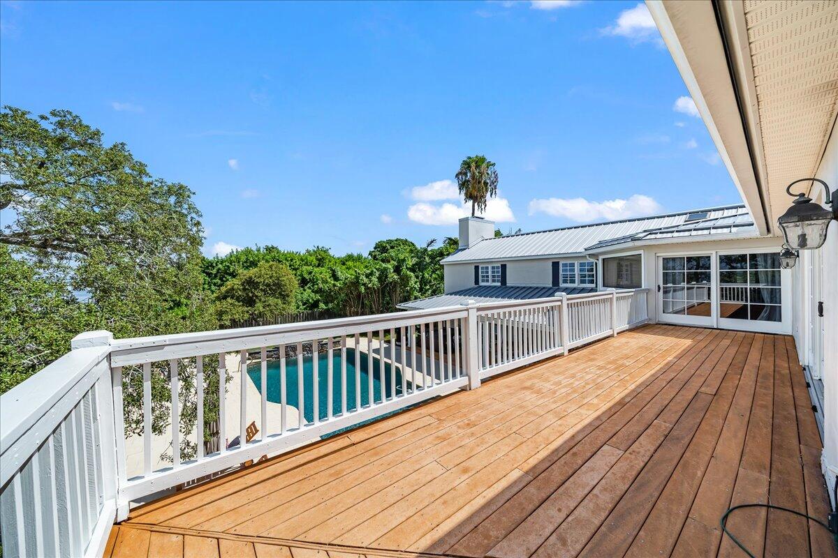 1650 North Riverside Drive Indialantic, FL 32903 - Photo 42 of 88 a view of a balcony with wooden floor and fence