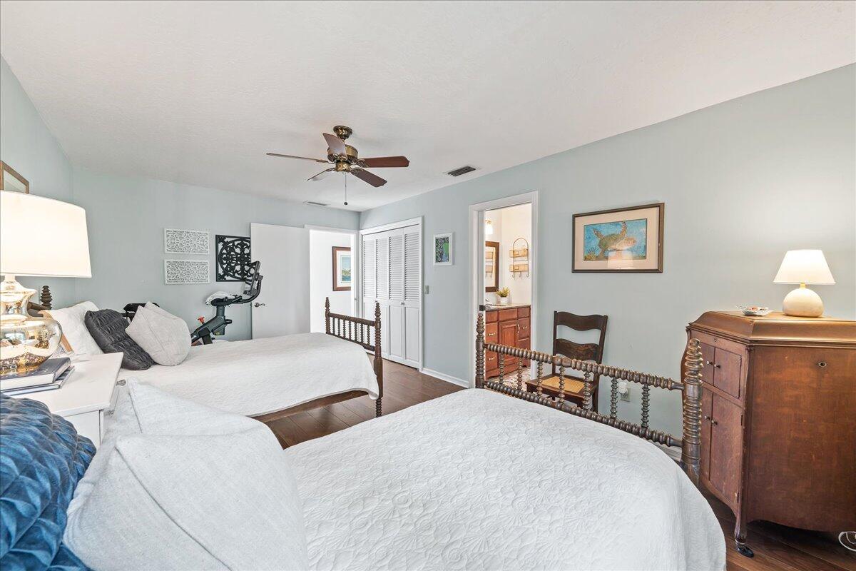 1650 North Riverside Drive Indialantic, FL 32903 - Photo 56 of 88 a bedroom with a bed and wooden floor