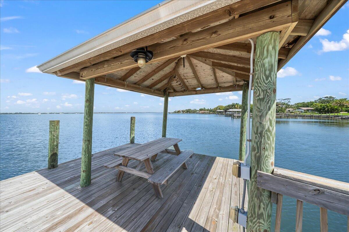 1650 North Riverside Drive Indialantic, FL 32903 - Photo 75 of 88 a view of balcony with wooden floor and lake view