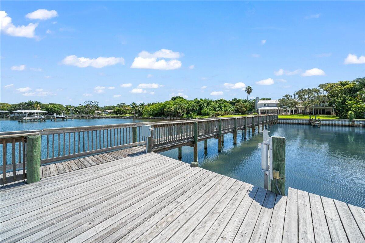 1650 North Riverside Drive Indialantic, FL 32903 - Photo 76 of 88 a balcony with wooden floor and lake view